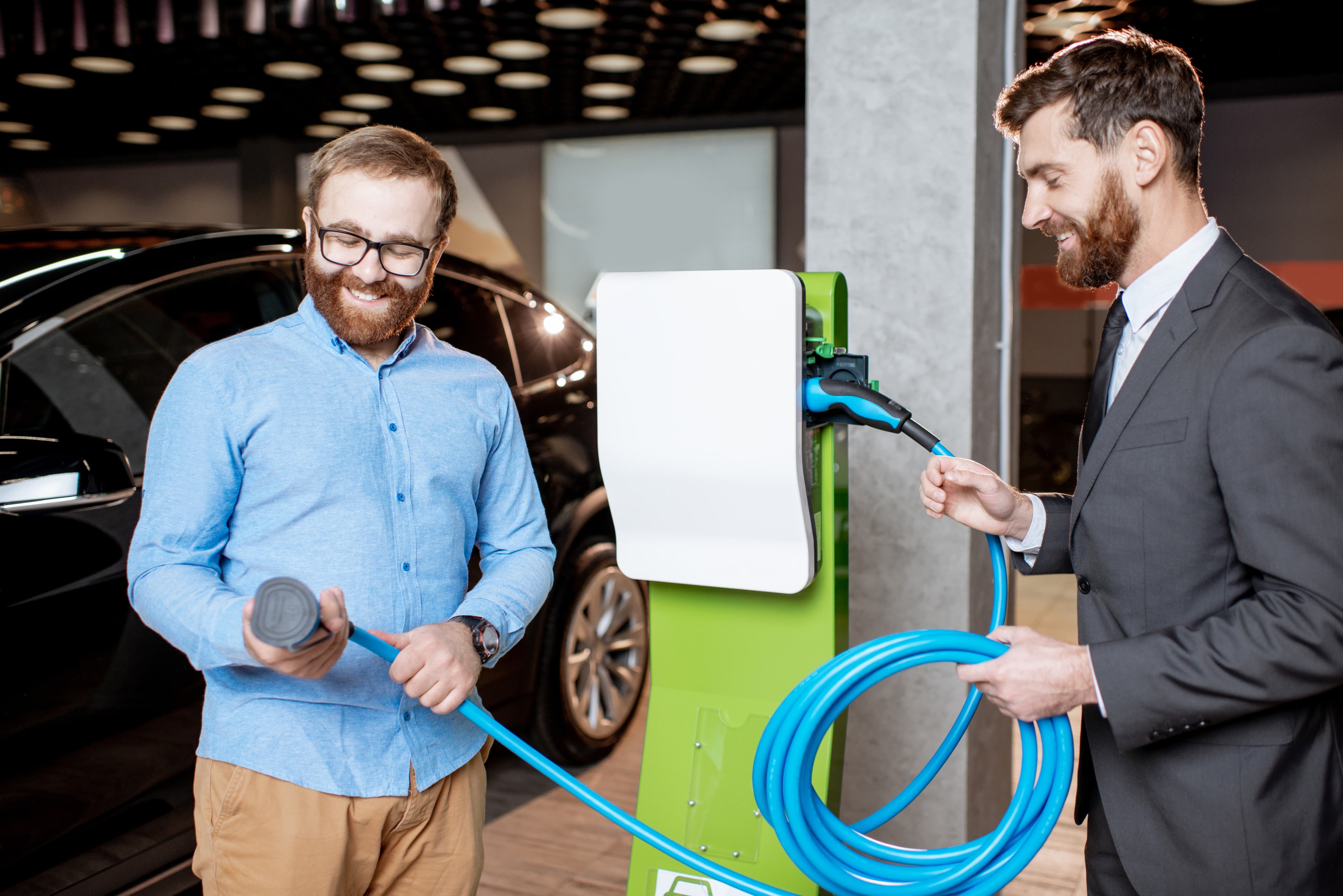 Shoppers reviewing a premium EV charger and accessories